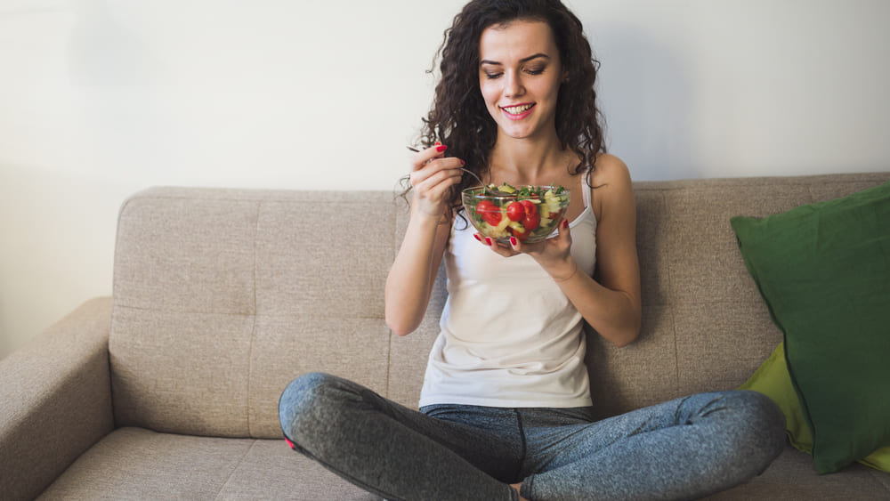 Young woman eating single ingredient foods.